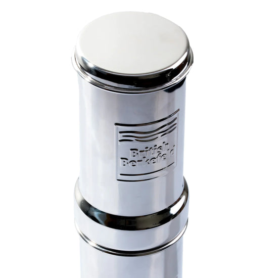 The American Reserves British Berkefeld 1 Liter Stainless Steel Gravity System uses Ultra Sterasyl ceramic filters for efficient purification and showcases an embossed logo.