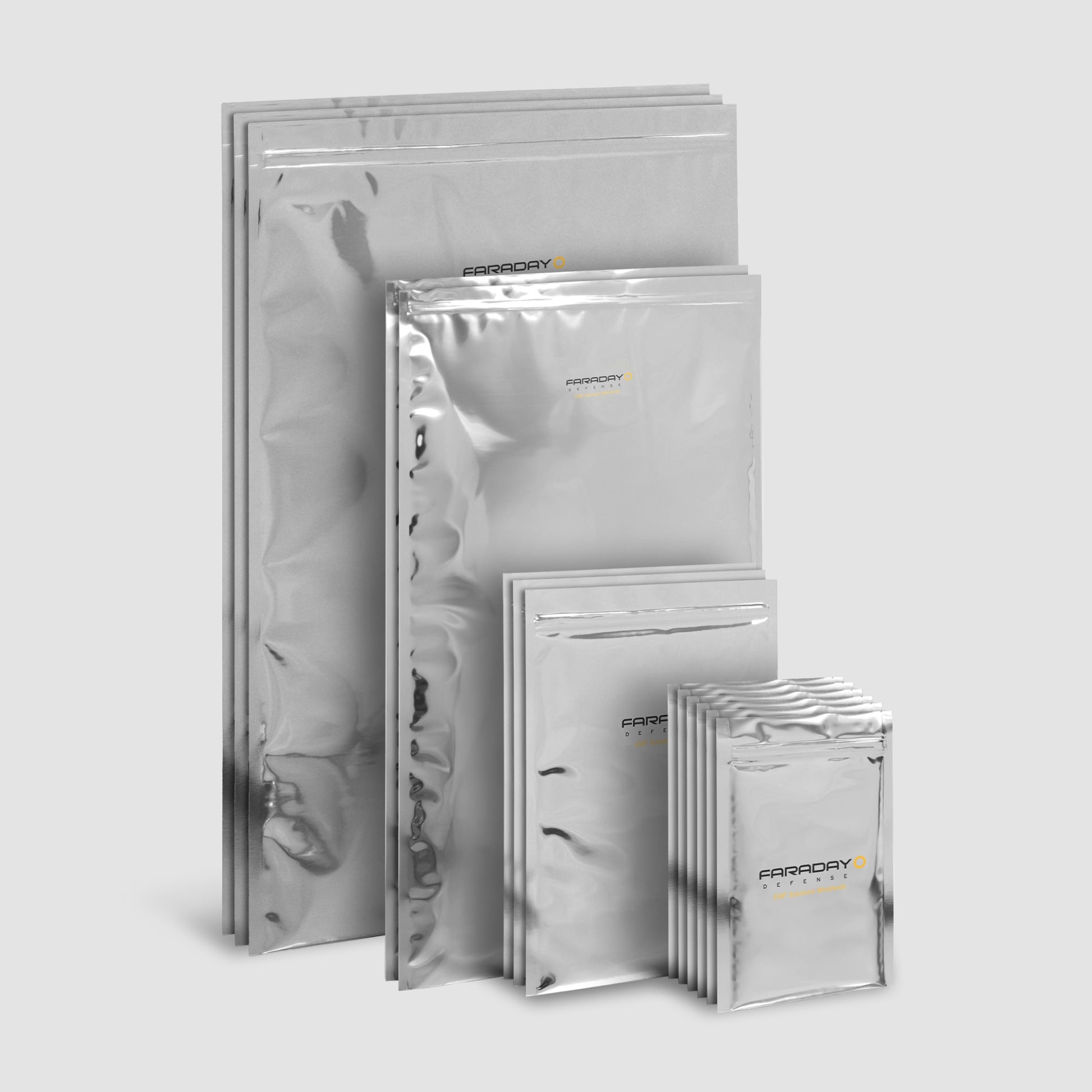 The 15pc 7.0 Mil Faraday EMP Kit by American Reserves, featuring metallic bags with sturdy zip-lock closures for optimal electromagnetic radiation protection, is displayed against a gray background.