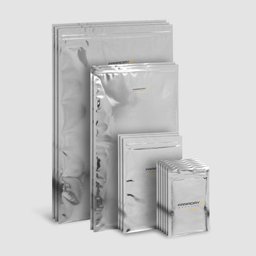 The 15pc 7.0 Mil Faraday EMP Kit by American Reserves, featuring metallic bags with sturdy zip-lock closures for optimal electromagnetic radiation protection, is displayed against a gray background.