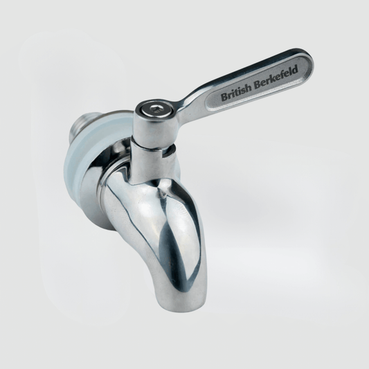 The British Berkefeld® Stainless Steel Gravity Tap from American Reserves gleams on a pristine white background, showcasing its sleek design with a labeled lever.