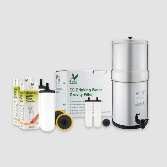 The American Reserves 3.17 Gallon Fluoride Filter Bundle, including the British Berkefeld Doulton Gravity-Fed Water Filtration System and Ultra Fluoride Filter, features replacement elements and product packaging displayed on a gray background.