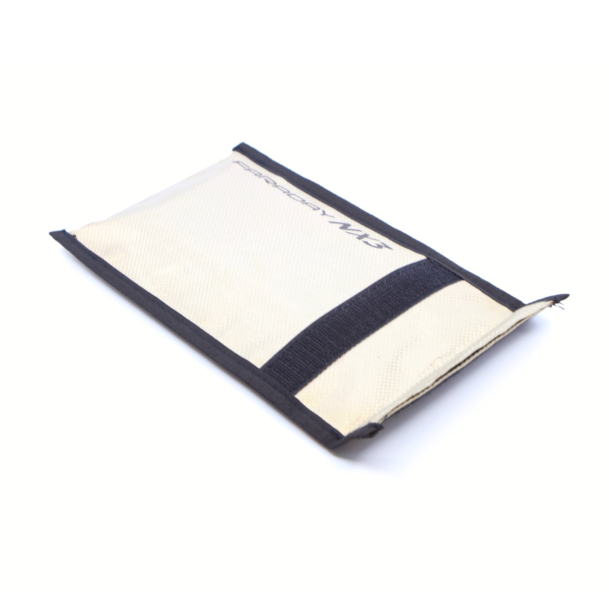 A beige and black canvas wallet with Velcro flap rests on a white surface, part of the Triple Layer CYBER Fabric Faraday Bags Kit (3 pack small) by American Reserves, featuring sleek design and signal-blocking technology for security on the go.