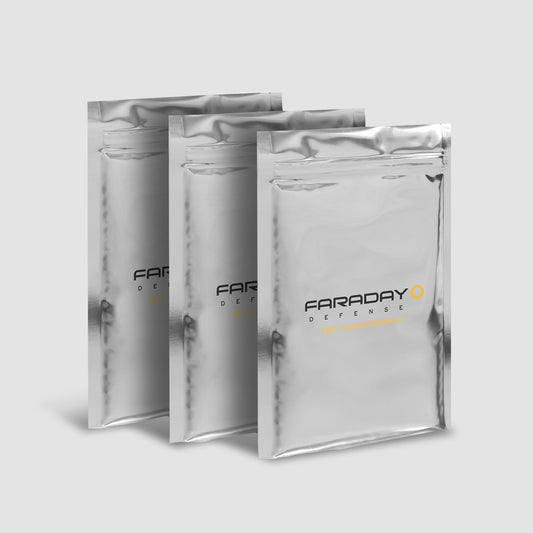 Three 7.0 Mil Faraday Cell Phone Bags (5 x 7), branded as American Reserves and designed for EMP protection, are arranged in a staggered line against a plain background.