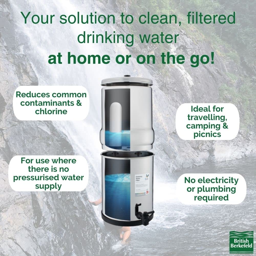 Image of the 2.25 Gallon British Berkefeld Doulton Countertop Gravity-Fed Water Filtration System by American Reserves, featuring four Ultra Sterasyl ceramic filter candles; reduces contaminants/chlorine, perfect for travel/camping/picnics, uses no electricity or plumbing. Waterfall backdrop.