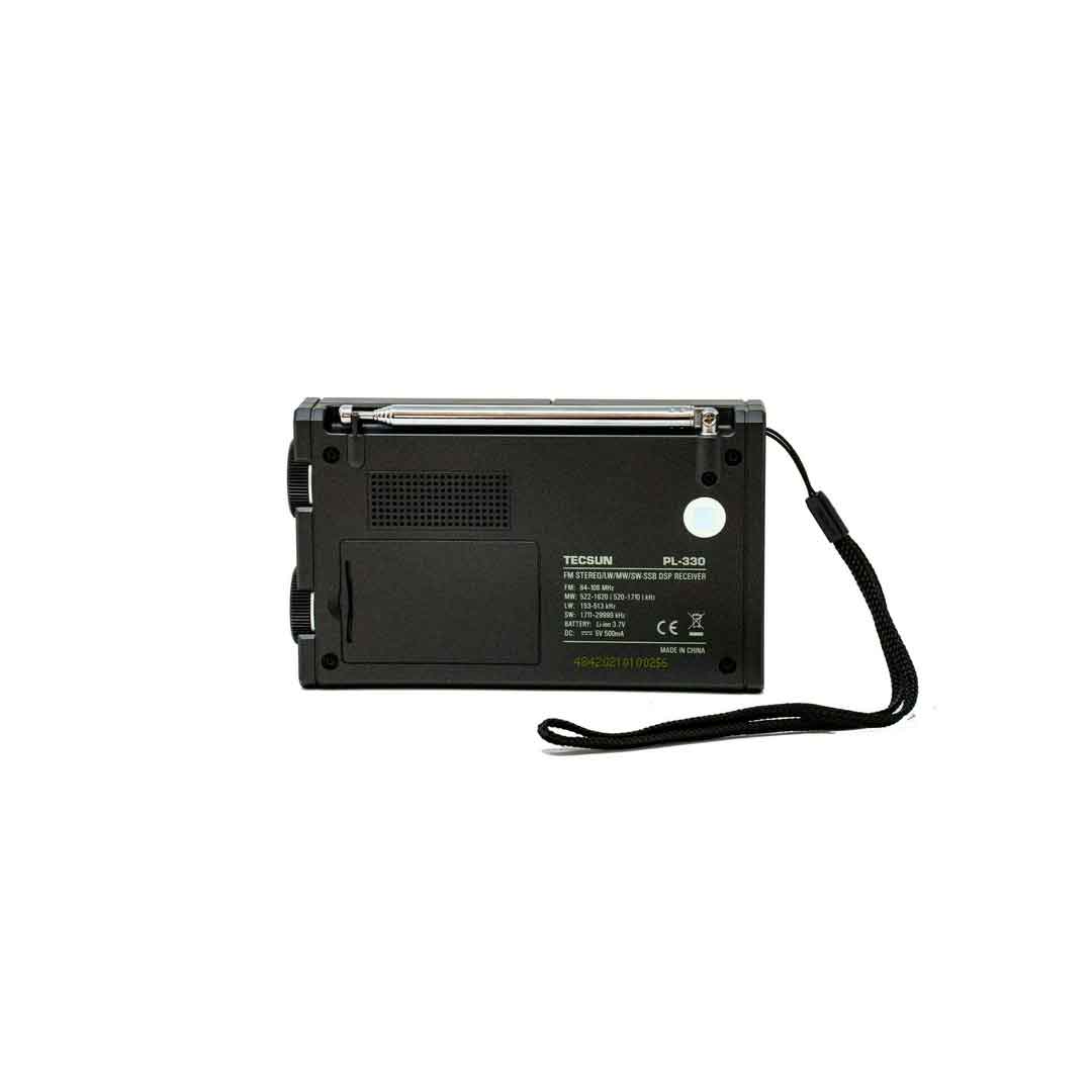 The back view of the American Reserves Tecsun PL330 Portable AM FM Shortwave PLL DSP Radio with SSB and Synchronous shows an antenna, carrying strap, and visible tuning dial.