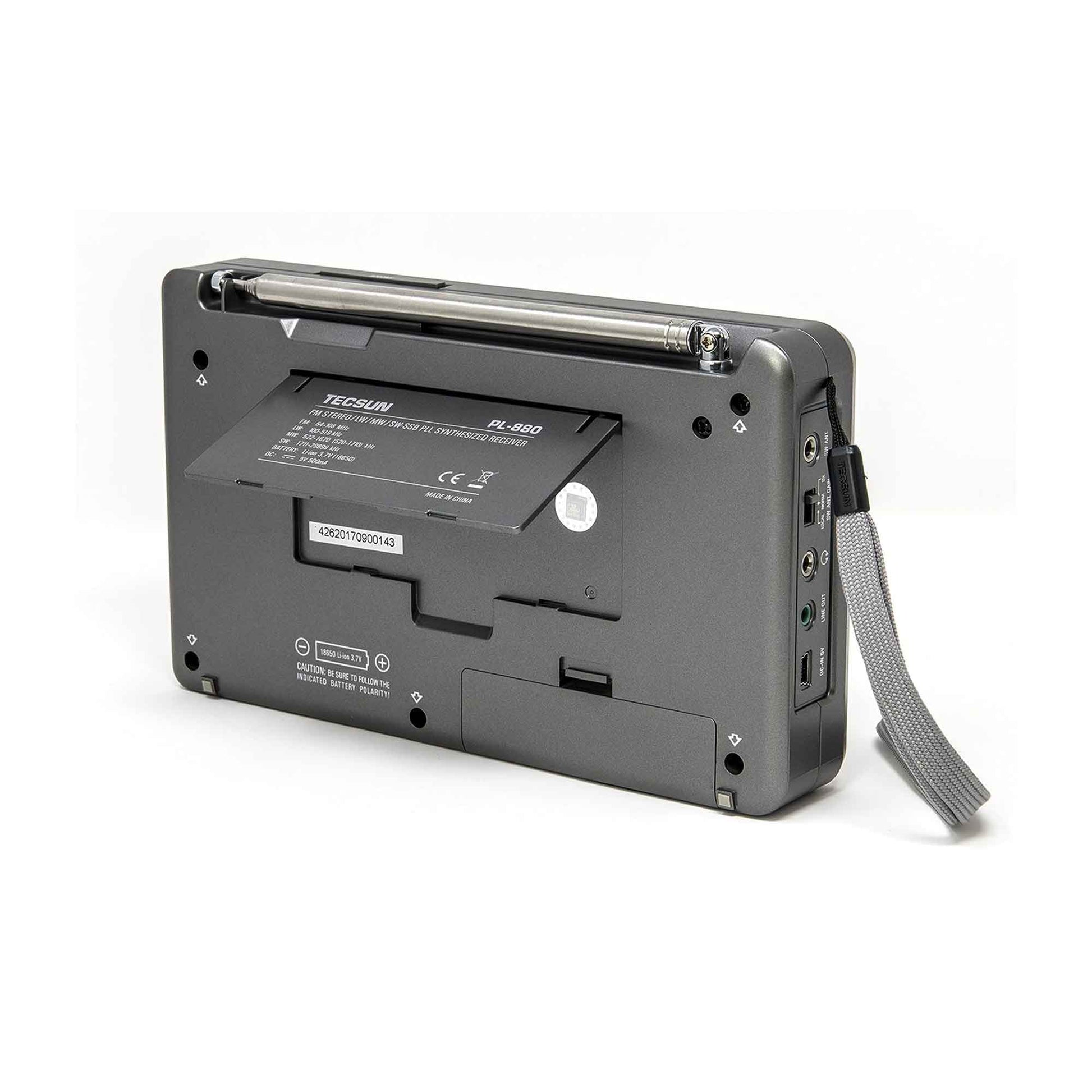 Rear view of the Tecsun PL880 by American Reserves shows a folded telescopic antenna, battery compartment for rechargeable batteries, input/output ports, and a wrist strap.
