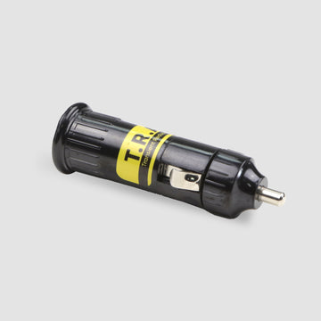 A black and yellow cylindrical Auxiliary EMP Vehicle Protection by American Reserves, featuring a metal clip and prongs for transient protection device applications, lies on a light gray surface.