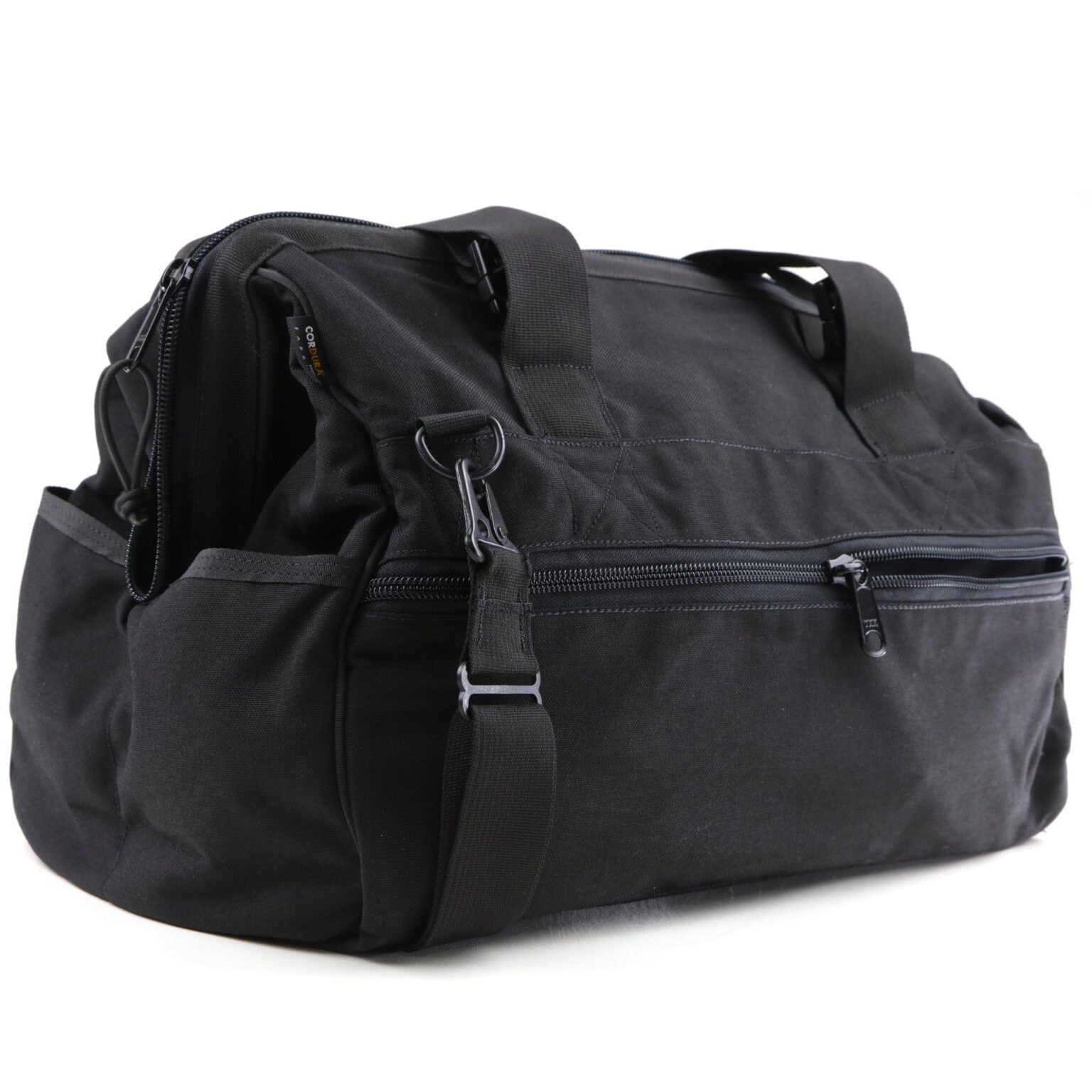 The American Reserves CORDURA® Utility Bag Large is a black duffel with a shoulder strap, two handles, a zippered side pocket, and a spacious main compartment perfect for all your essentials.