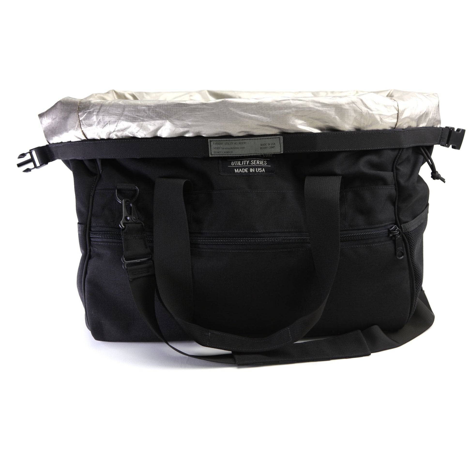 The American Reserves CORDURA® Utility Bag Large, made in the U.S.A., is a black utility bag with multiple compartments and straps. It features a metallic top flap and signal-blocking technology to protect your electronics on the go.