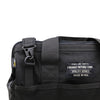 Close-up of a black CORDURA® Utility Bag Medium by American Reserves featuring a zipper, clip, and label reading Faraday Defense Corp. Utility Series Made in USA. This signal-blocking pouch keeps your items secure and protected.
