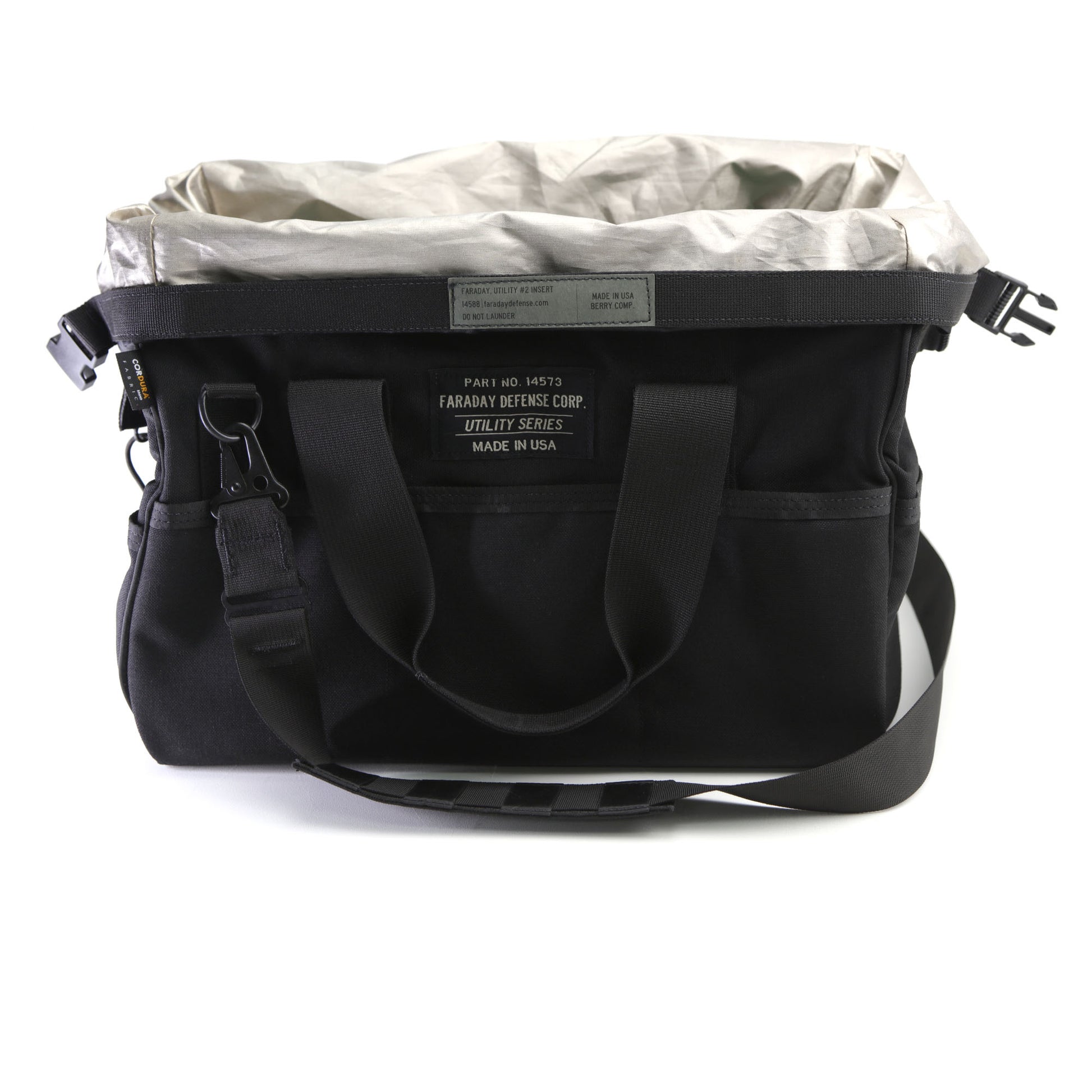 The Black and Gray CORDURA® Utility Bag Medium from American Reserves features multiple pockets, an adjustable shoulder strap, and a front label. It now also includes a Faraday pouch for enhanced signal-blocking protection.