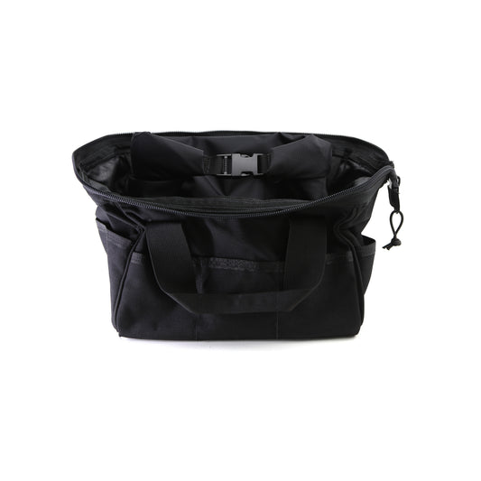The CORDURA® Utility Bag Small from American Reserves is a durable black tote with an open top and handles. Featuring multiple pockets and an internal buckle strap, it blends style and functionality for daily use.