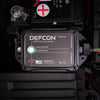 The DEFCON™ Vehicle + EMP Vehicle Protection Kit by American Reserves, also a surge protector, features a reassuring green light for full protection and mounts securely near the car battery.