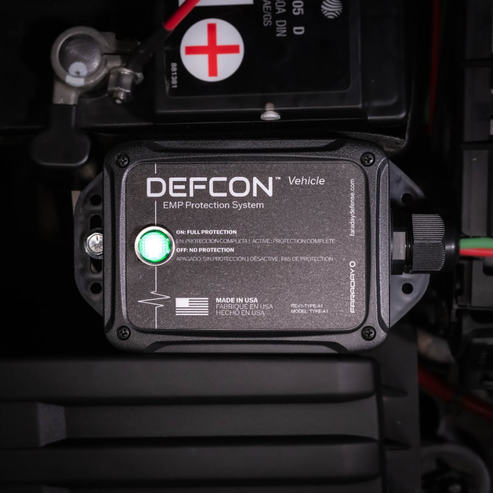 The DEFCON™ Vehicle + EMP Vehicle Protection Kit by American Reserves, also a surge protector, features a reassuring green light for full protection and mounts securely near the car battery.