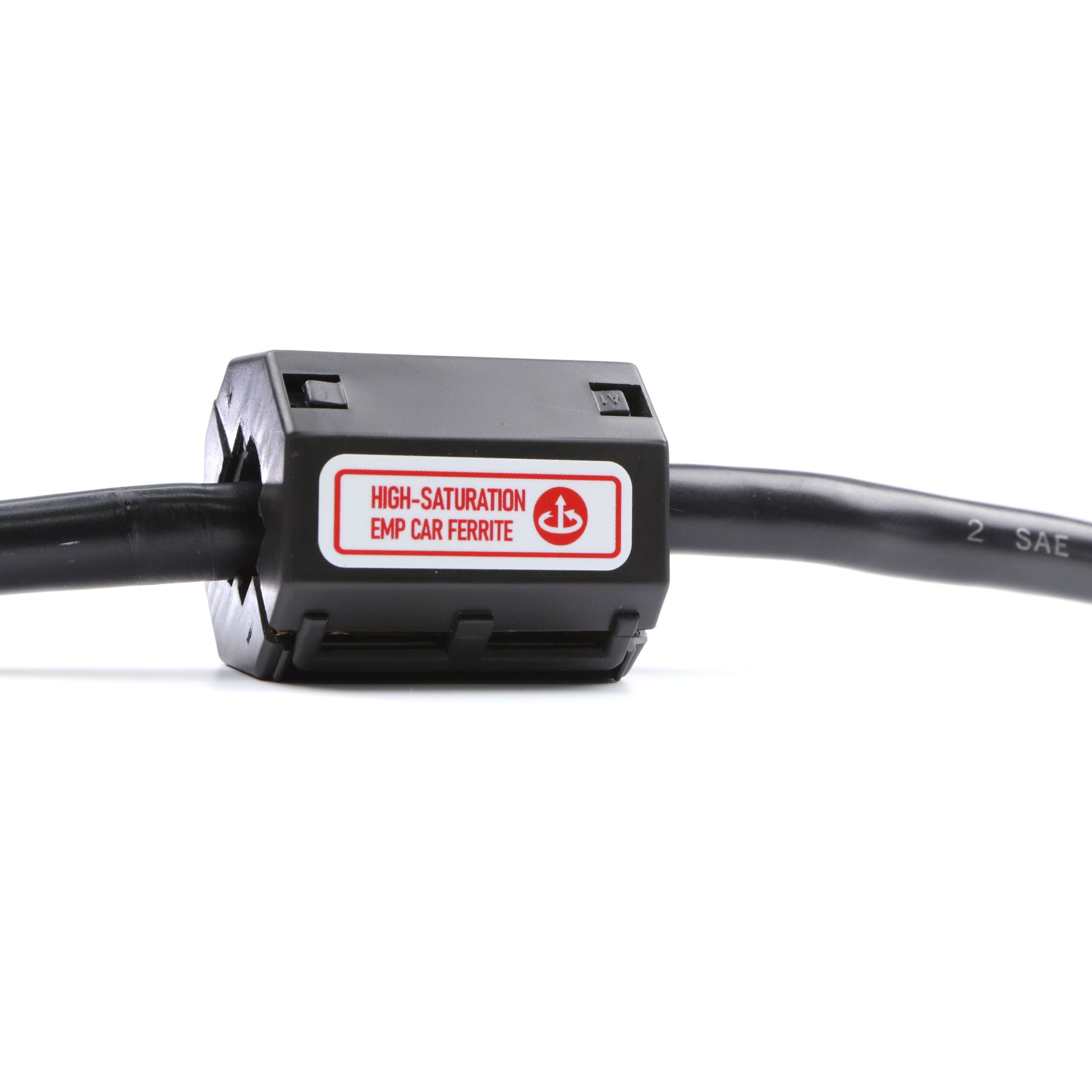Close-up of a black cable with a rectangular ferrite core, part of the DEFCON™ Vehicle + EMP Protection Kit by American Reserves, providing advanced vehicle protection.