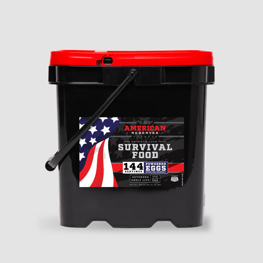 The large black bucket labeled Emergency Freeze Dried Powdered Eggs - 144 Servings from American Reserves features a red lid and an American flag design. This supply, fortified with vitamins and minerals, ensures a reliable 10-year shelf life for peace of mind.