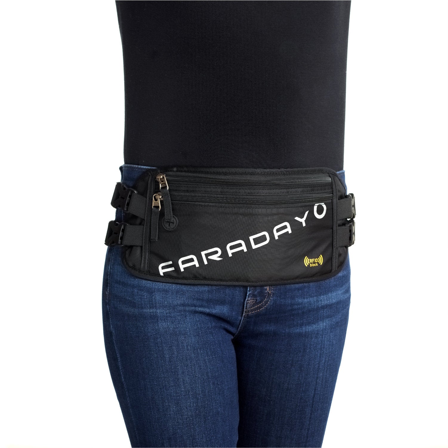 Someone wearing an American Reserves Faraday Waist Pack - RFID Belt Bag in black, featuring FARADAY on it. This fashionable pack includes multiple zippered compartments for RFID blocking and EMP protection, comfortably worn around the waist over blue jeans.