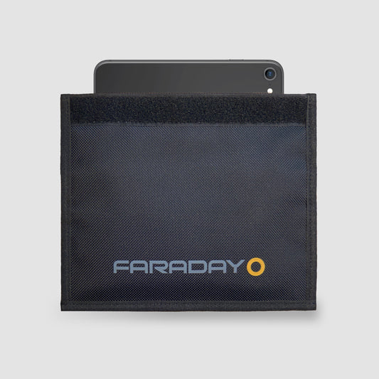 A black Forensic Faraday Cell Phone JACKET (4.5″ x 8″) by American Reserves, with clear branding, partially encases a smartphone against a plain gray background, offering EMF protection and signal blocking.