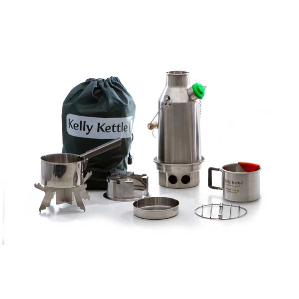 The Kelly Kettle® Ultimate Trekker Camping Kit by American Reserves features a stainless steel camping kettle set with a pot, cup, lid, and a convenient carrying bag labeled Kelly Kettle.