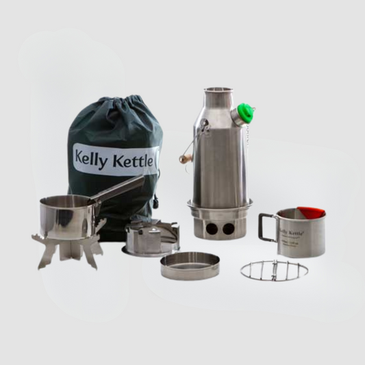 The American Reserves Kelly Kettle® Ultimate Trekker Camping Kit includes a kettle, mug, pot stand, and pot with handy accessories, all neatly packed in a drawstring bag against a gray background.