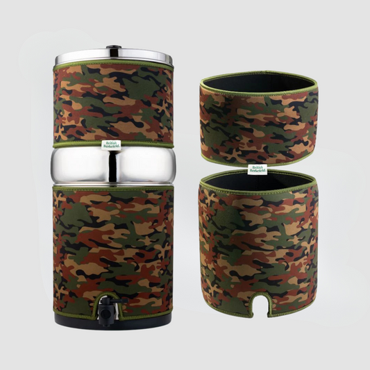 Discover the American Reserves Insulating Gravity System Sleeve, a stainless steel water filter ideal for outdoor adventures. This essential gear features a camouflage-patterned neoprene sleeve and an additional camo sleeve, ensuring clean hydration against a subtle gray backdrop.