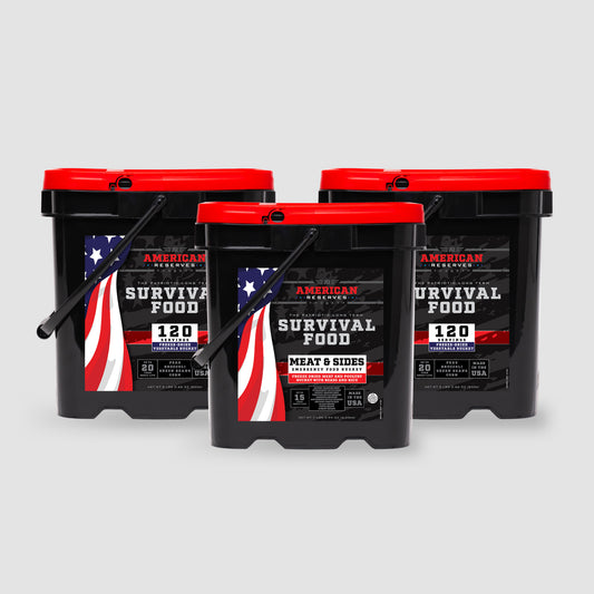 Three black Survival Food buckets with red lids, labeled 120 Servings, offer a reliable emergency supply. Featuring American flag elements, the American Reserves Meat and Produce Bundle ensures freeze-dried foods with a long-term shelf life, complete with meat and sides.