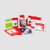 The Red 64 Piece Survival Backpack by American Reserves includes a portable stove, fuel tablets, metal cup, camping essentials, and a first aid kit with 39 pieces. All items come packed in red packaging against a plain background.