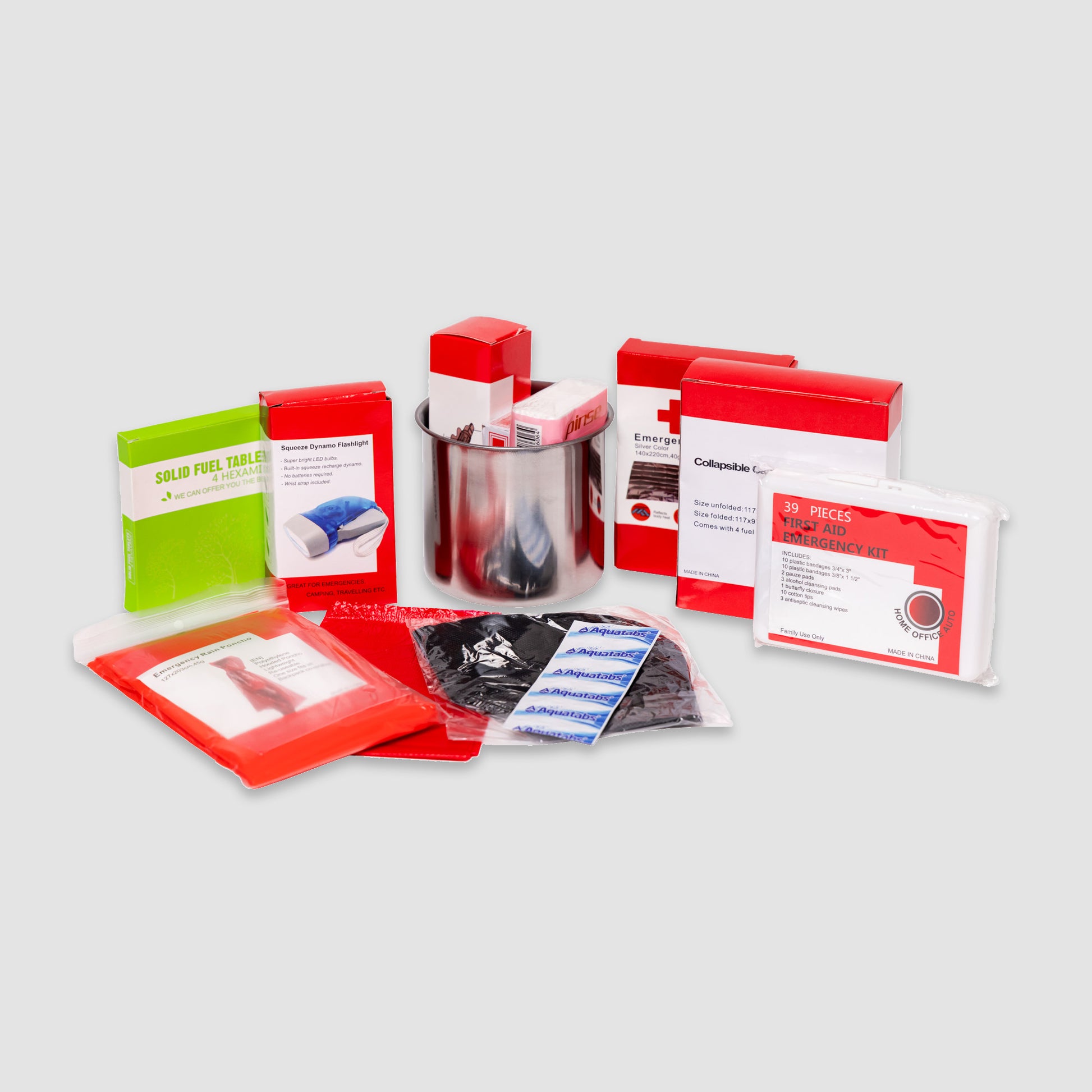 The Red 64 Piece Survival Backpack by American Reserves includes a portable stove, fuel tablets, metal cup, camping essentials, and a first aid kit with 39 pieces. All items come packed in red packaging against a plain background.