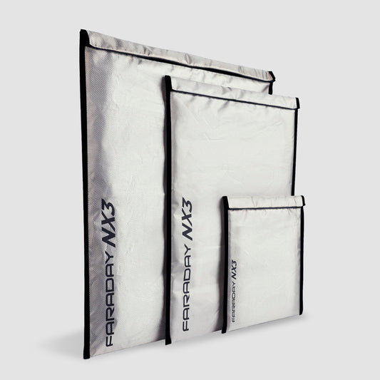 Three medium silver Faraday bags from American Reserves Triple Layer CYBER Fabric Kit feature the black text FARRADAY MX3 and provide superior EMF protection for your devices.