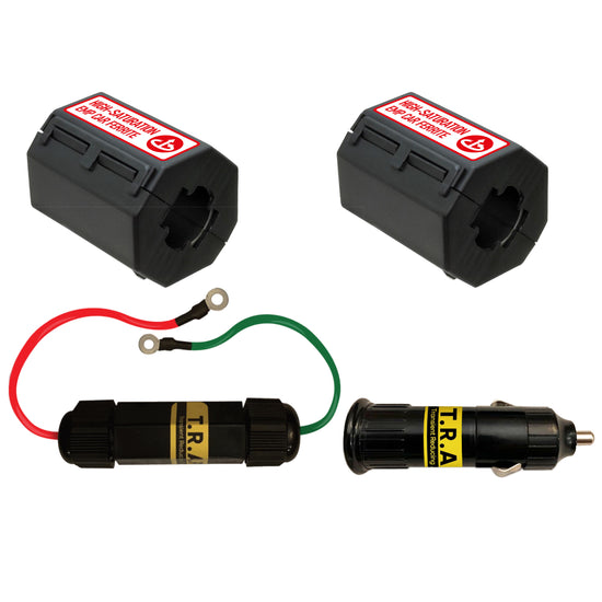The Complete Auto And Home Protection EMP Kit by American Reserves features two black device cases with warning labels, a black cylindrical T.R.A connector, two wires with ring terminals, and a black car adapter for reliable EMP defense in both auto and home settings.