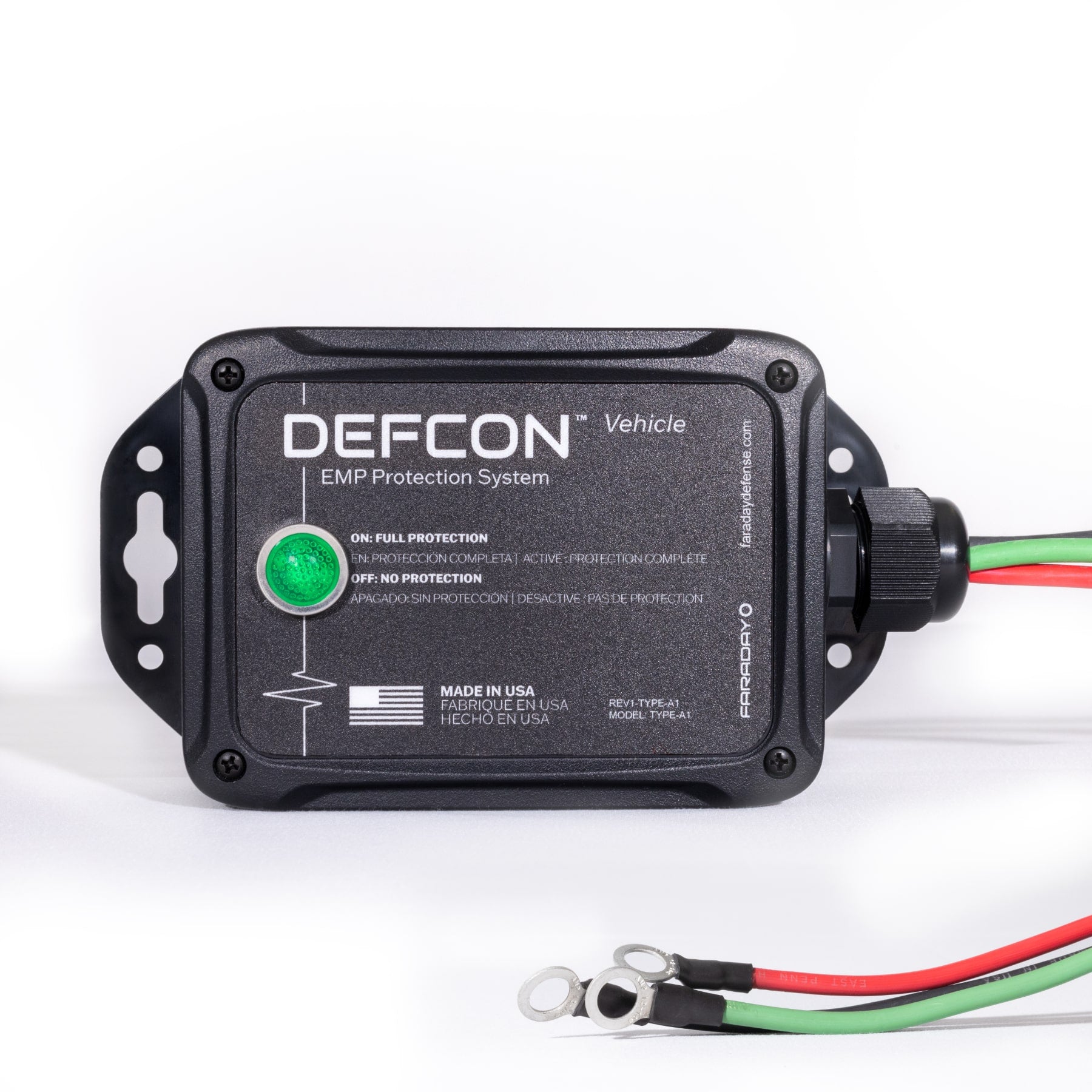 The Complete Auto And Home Protection EMP Kit by American Reserves is a black box with a green indicator light, three metal-looped wires, and text on its function and origin, offering robust defense against electromagnetic pulses for vehicles and homes.