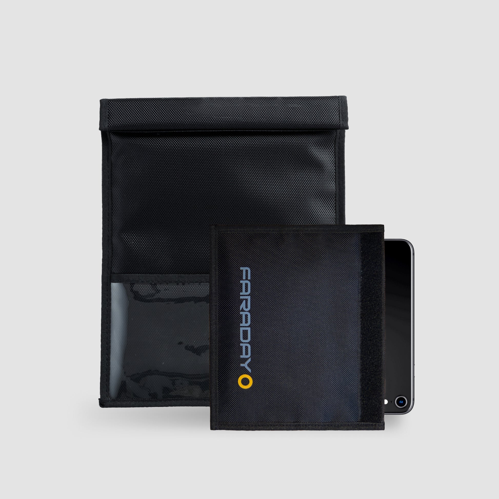 The XXL Forensic Faraday Jacket Kit by American Reserves includes a black set with an open larger pouch and a smaller pouch inside, partially covering a smartphone for effective device shielding.